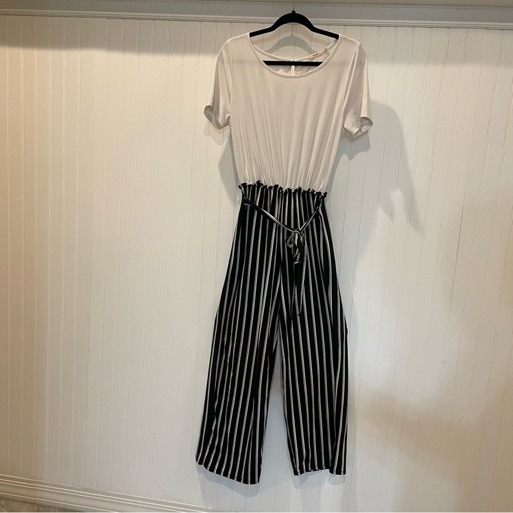 Francesca’s Soft Black & White Stripped Jumpsuit With Tie In Front
